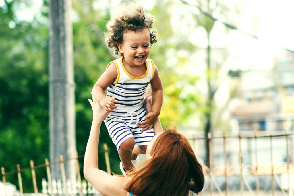 Parent playing with child in Upper West Side, NY.