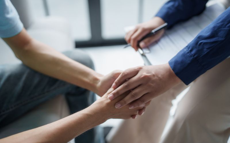 Therapist offering support during anxiety counseling session