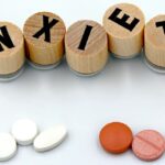 Anxiety Relief Pills and Wooden Blocks Display