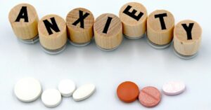 Anxiety Relief Pills and Wooden Blocks Display