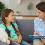 Child speaking with therapist during one-on-one counseling session