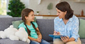 Child speaking with therapist during one-on-one counseling session
