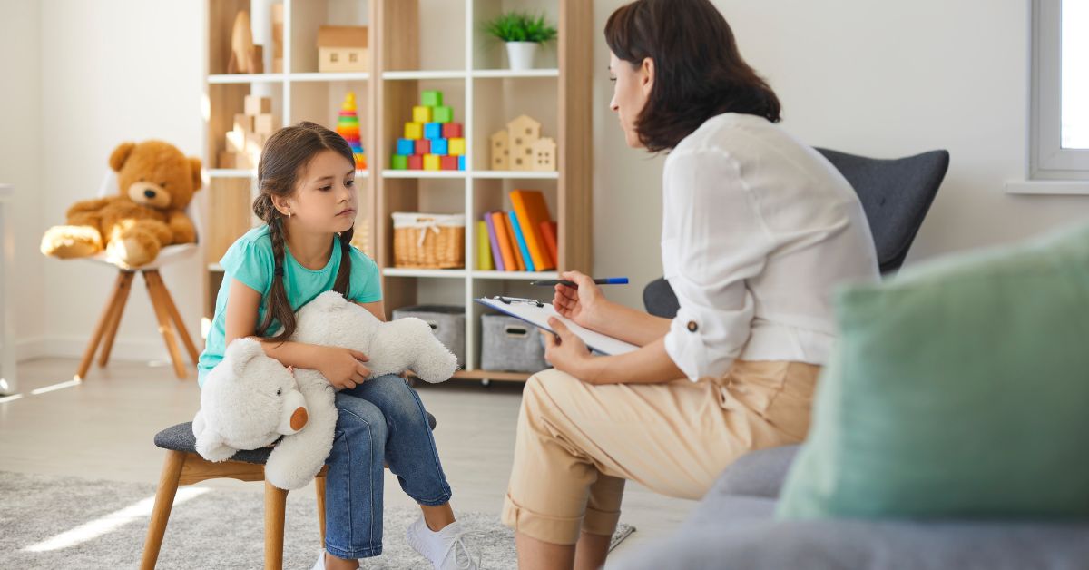 Therapist talking to a timid child