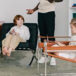 Kids with counselor having a therapy session indoors, fostering emotional support.